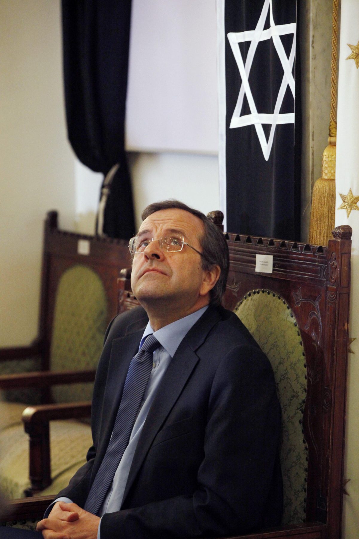 Greece’s Prime Minister Antonis Samaras attends a ceremony marking the 70th anniversary of the first deportation of Jews from Thessaloniki to Auschwitz inside the Monastirioton synagogue