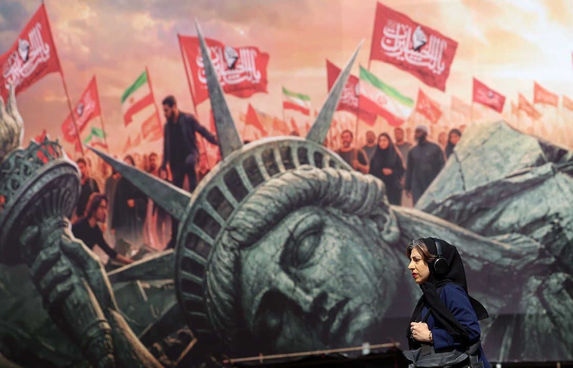 17069341d A woman walks past an anti-US bilboard in Tehran, Iran